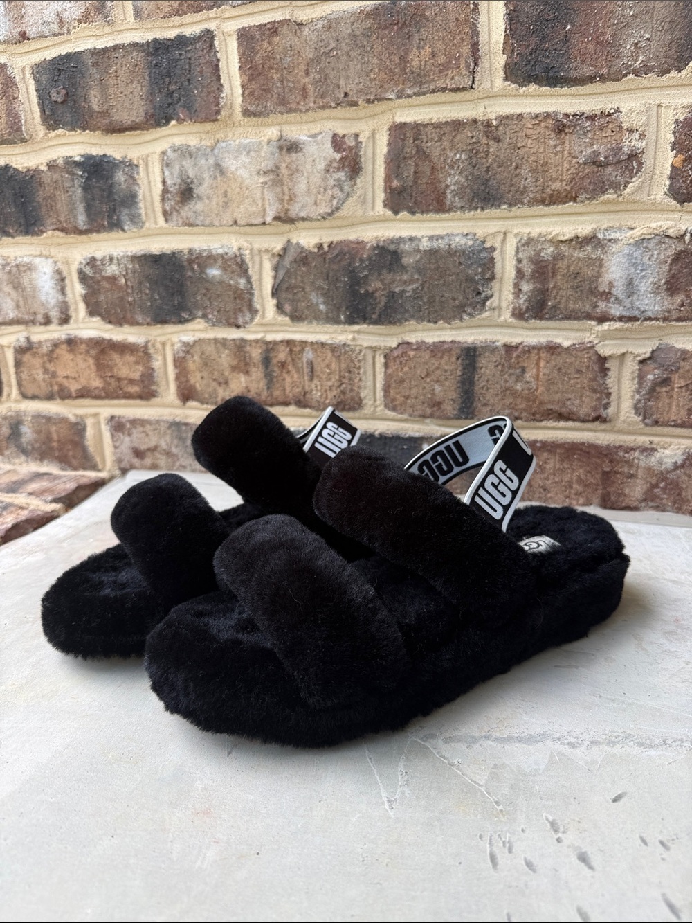 UGG women’s black slippers / shoes